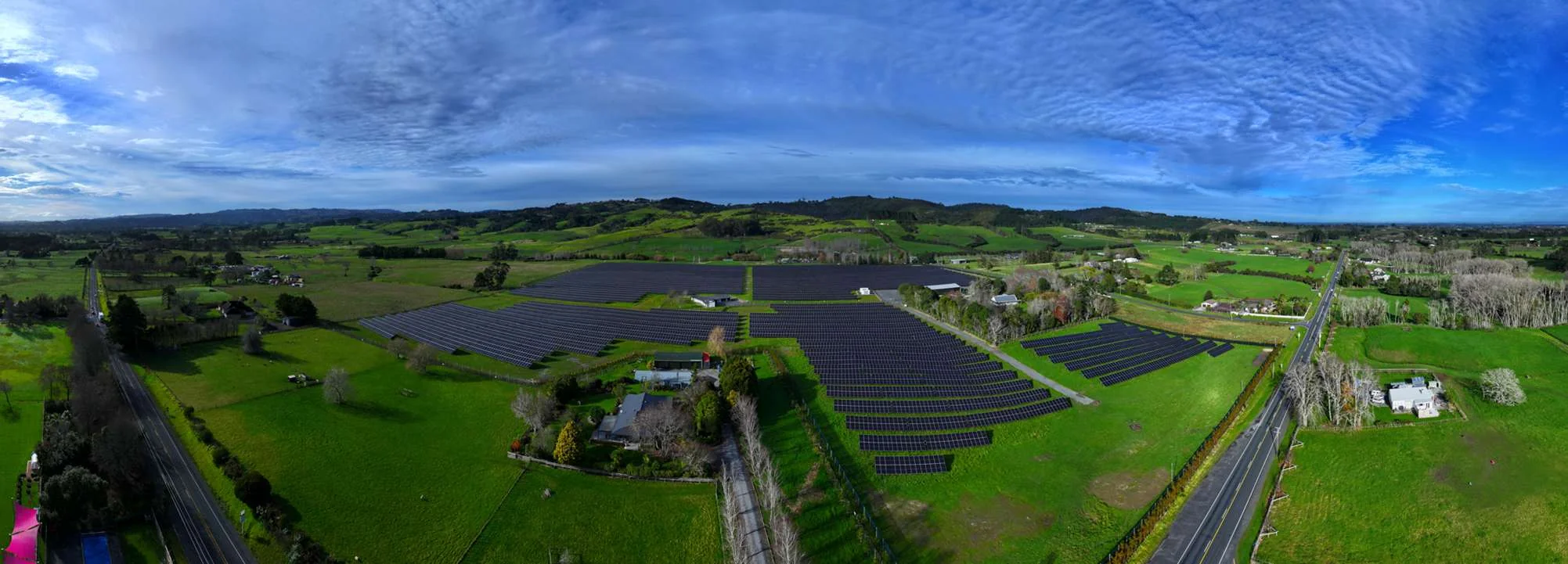 Solar farm among green rolling countryside in New Zealand